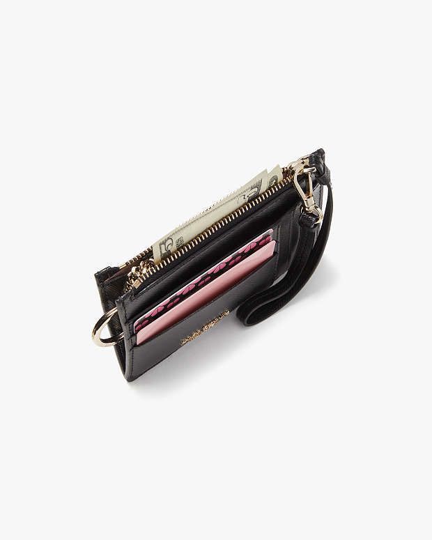 Tarjetero con ventana para identificación y pulsera de Kate Spade en dorado metalizado