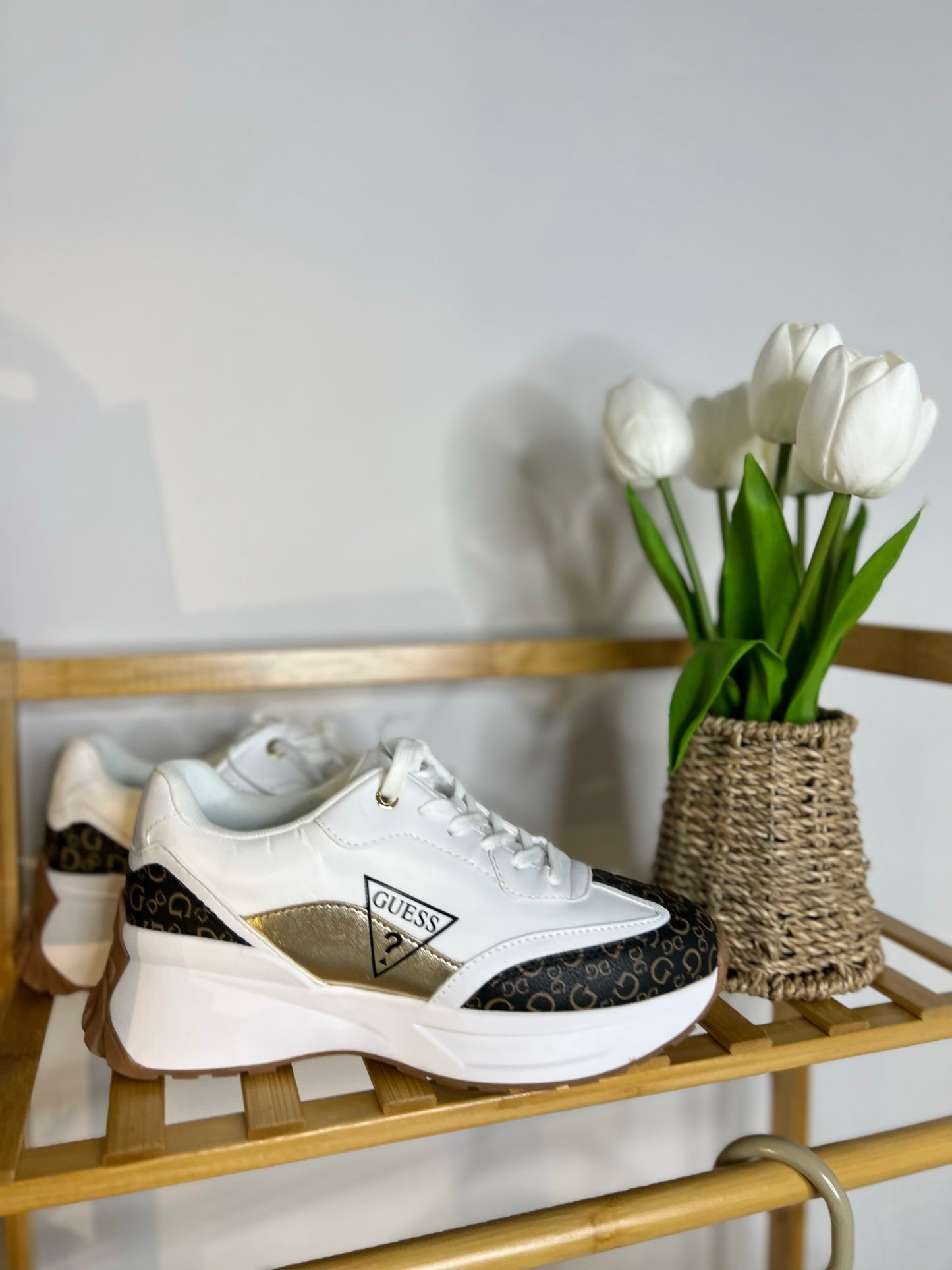 White guess tennis shoes with brown details