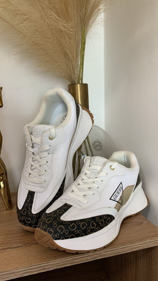 White guess tennis shoes with brown details